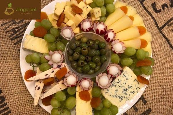 Tasty gourmet meat, cheese & marinated olive antipasto platter catering at the Village Deli Bongaree